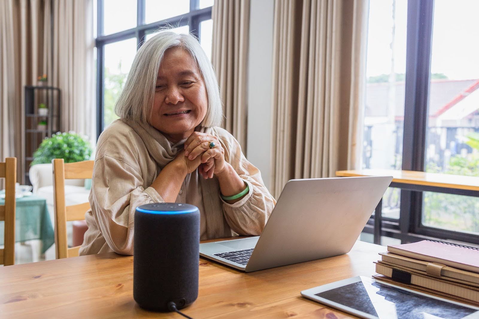 Senior woman connecting her Alexa